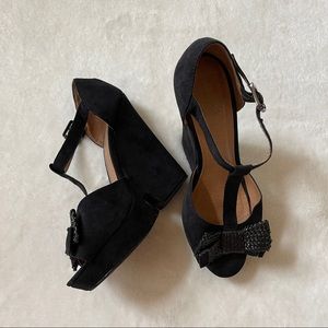 Black bow wedge heels